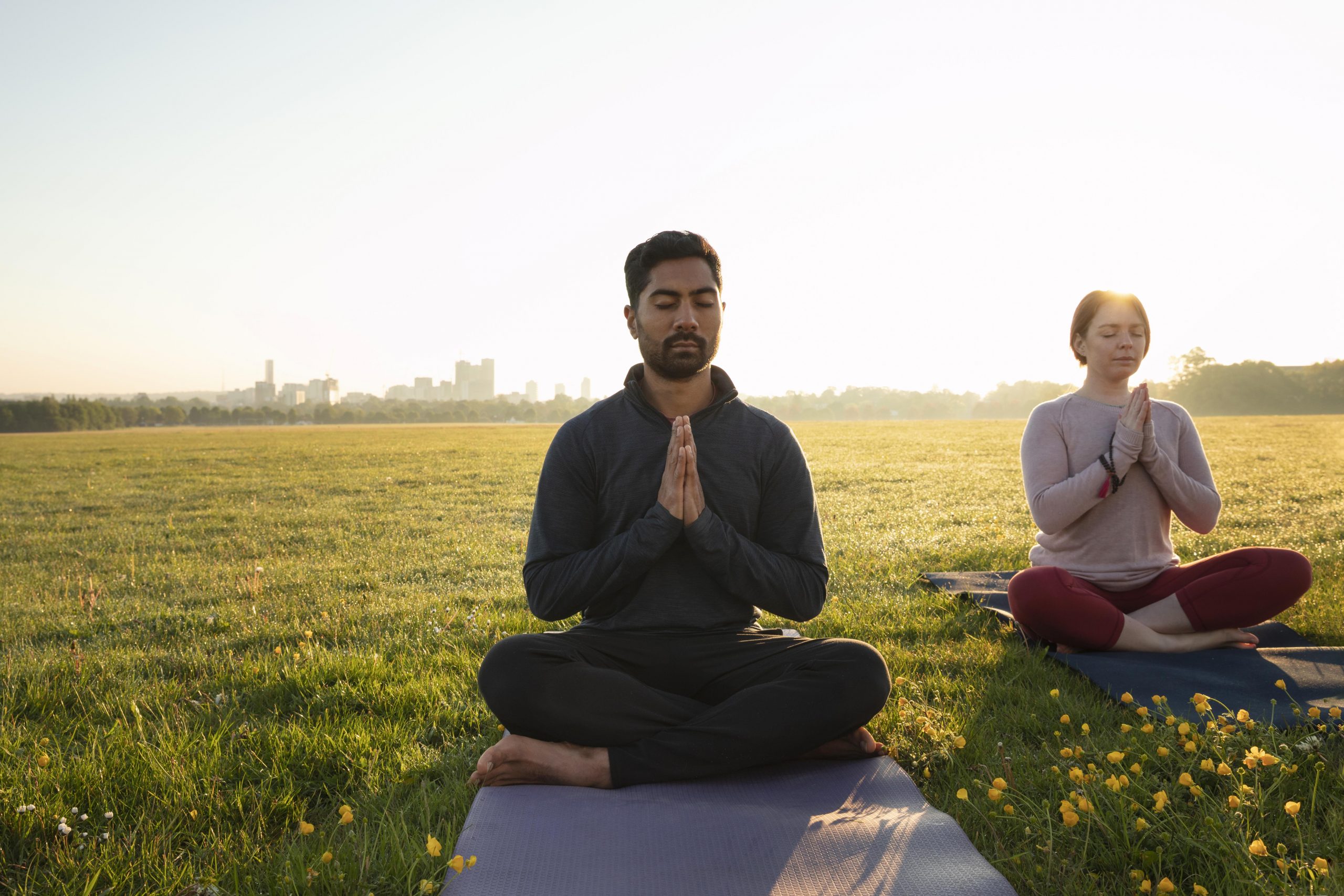 front-view-man-woman-meditating-outdoors-scaled.jpg