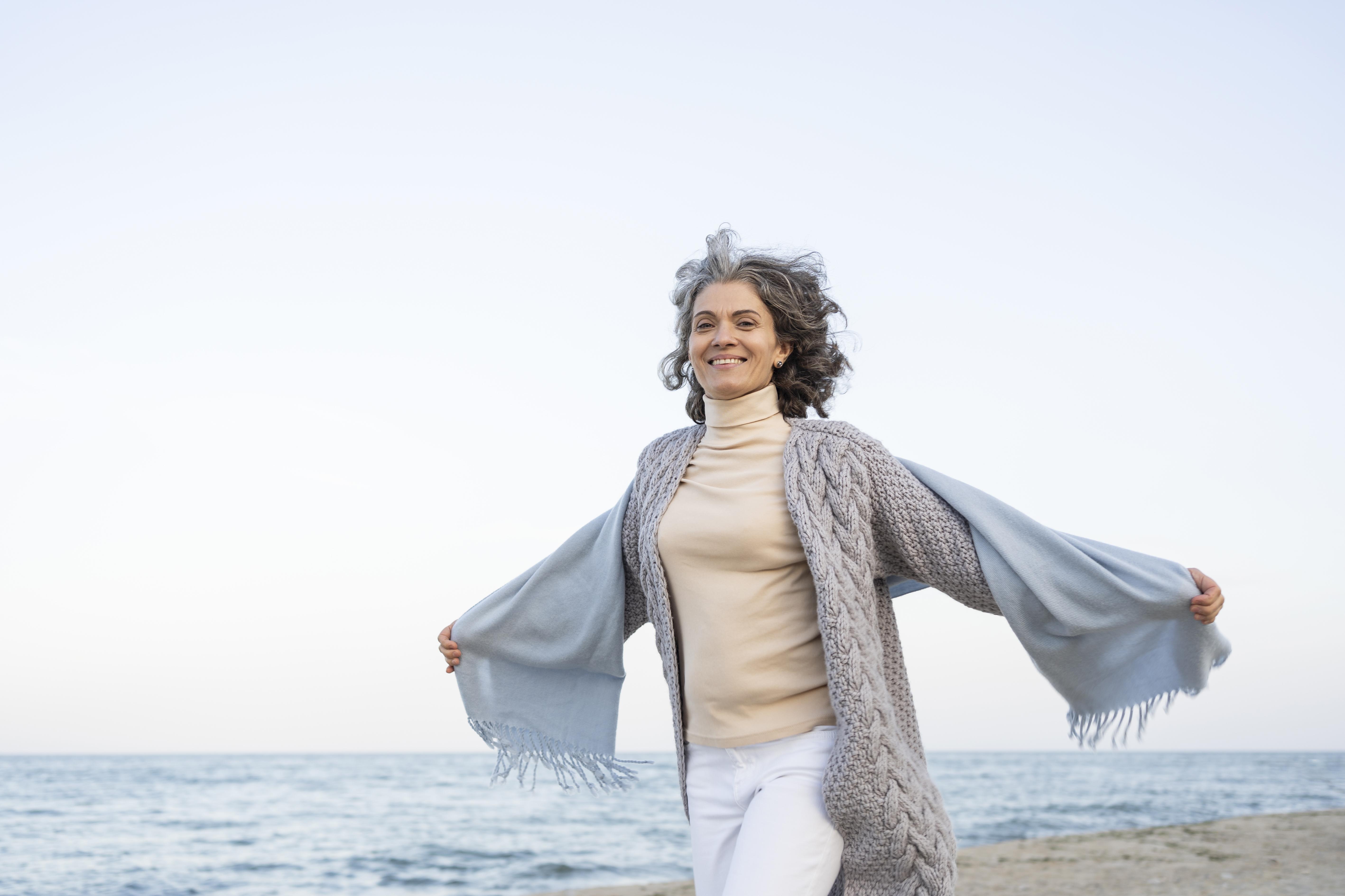 older-woman-enjoying-her-time-beach.jpg